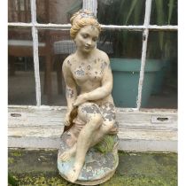 A seated lady with weathered painted finish approximately 55cms high.