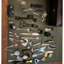 A collection of various items to include hardstone button hooks, EPNS caddy spoons, strainers,