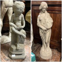 A pair of cast statues,  a semi nude lady and a small boy reading  small boy stands approximately