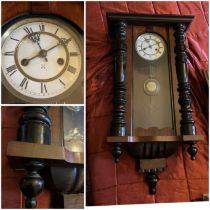 An early 20th century mahogany cased Vienna wall clock, the dial with Roman numerals, the case