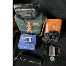 A sanyo video camera, carry bag and charger plus a pair of field glasses, compas, hip flask torch