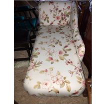 A compact Chaise Longue measuring 154cm in length, upholstered in a floral fabric.