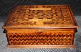A Victorian Parquetry Work Box inlaid with various different woods.  It is inlaid with blue fabric.