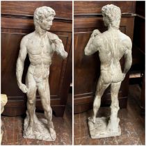 A cast statue in the style of David 85cms high weathered effect.