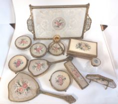 A group of Brass / gilt metal, embroidered dressing table accessories. To include a lace filigree