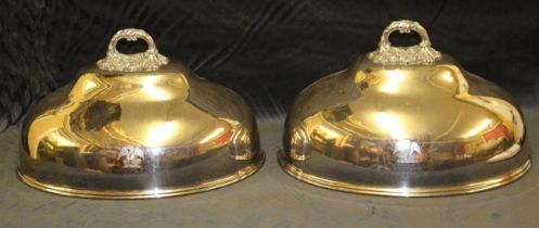 A pair of 19th century Sheffield plated domed oval meat dish covers with cast foliate handles,