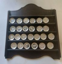 Small wooden display shelves with the full set of silver coloured shallow floral alphabet plates ,