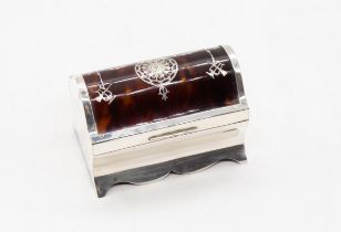 An Edwardian silver and tortoiseshell jewellery casket, the plain silver base with wavy apron, the