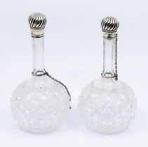 A pair of late Victorian silver mounted hob nail cut glass onion shaped scent / perfume bottles, the