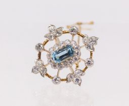 An Edwardian aquamarine and diamond gold brooch, comprising an open work design set to the centre
