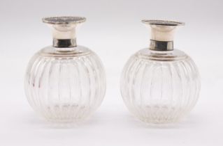 A pair of George V silver and tortoiseshell mounted glass scent bottles and cover, the globular
