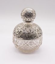 An Edwardian silver mounted large hob nail cut glass globular scent bottle and cover, the upper