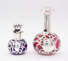 An early 20th Century white metal mounted onion shaped ruby glass scent bottle and stopper, the