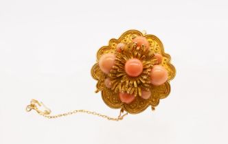 A late Victorian coral and gold brooch pendant, comprising nine graduated round coral beads in a