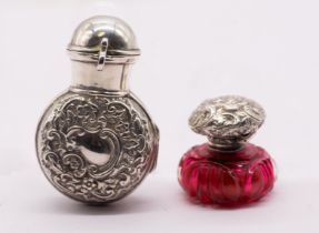 A late Victorian silver scent bottle holder and cover, the body chased with scrolling foliage with