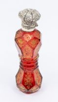 A 19th Century Continental facet cut waisted ruby glass scent bottle decorated with gilt flowers and