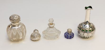 A collection of silver topped, cased or cased perfume/scent bottles to include; a Victorian