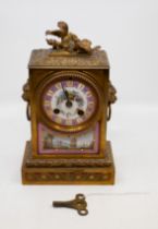 A 19th Century French gilt metal mounted mantle clock, the Sevres style Pompadour pink ground dial