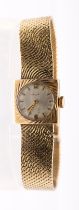 A ladies vintage Talis 9ct gold wrist watch, comprising a round silvered dial with applied baton and