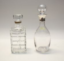 A Modern plain glass baluster decanter and stopper with silver plated mount and a Modern cut glass