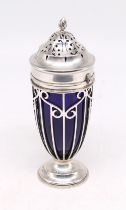 An Edwardian silver footed sugar caster, having elaborate stylised pierced casing, detachable top