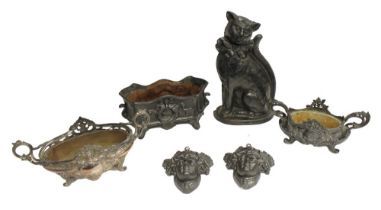 A cast-iron cat doorstop, an elaborately designed 19th century iron planter, two Art Nouveau style