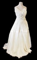 A Nottingham lace wedding dress by Madame Simpson of Leeds, c.1952/53. The dress is strapless with a