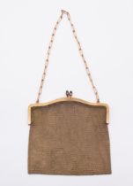 An Edwardian gold plated chain mail evening bag, the frame with stone set closure, frame also