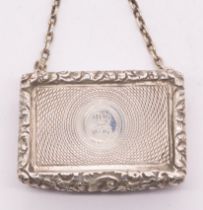 A George III silver vinaigrette, ornate cast border, radial engraved decoration to cover with