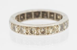 A diamond and platinum full eternity ring, comprising grain set round brilliant cut diamonds, each