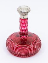 A late Victorian onion shaped ruby glass scent bottle, incised paterae to lower section, with