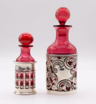 An Edwardian ruby glass scent bottle and stopper held in silver holder pierced and engraved with