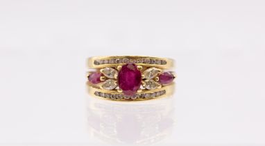 A ruby and diamond 18ct gold ring, comprising an oval mixed cut ruby to the centre within a flower