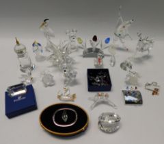 A collection of Swarovski glass figurines and items to include; a boxed Clown, a boxed Heron, a