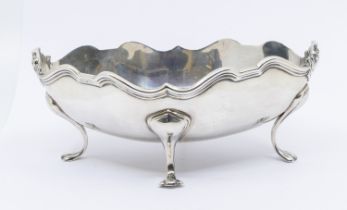 An  Edwardian silver stylised footed centre bowl, of oval form with ribbed edging and four pawed
