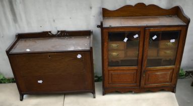 Large oak early 20th century smokers cabinet, with glazed and painted front opening doors. Along