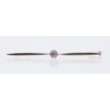 A diamond platinum and gold bar brooch, comprising a central old European cut diamond approx 0.35ct,