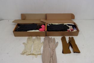 A collection of gloves in two boxes, to include leather black gloves, snakeskin, suede, crochet