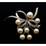 A vintage cultured pearl and white metal spray brooch, length approx 50mm, pin and trombone clasp,