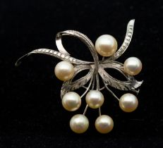 A vintage cultured pearl and white metal spray brooch, length approx 50mm, pin and trombone clasp,