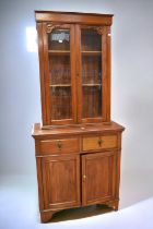 Edwardian mahogany cupboard bookcase with glazed top above two single drawers above two cupboard