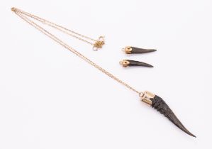 Three pendants one with chain, the large pendant comprising a horn/ antler with rose cap top