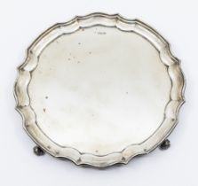 A Georgian style silver salver with pie crust rim, hallmarked Sheffield 1951, maker mark indistinct,