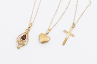 A collection of 9ct gold jewellery to include a garnet set scroll work pendant and chain, along with