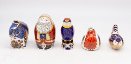 Five Royal Crown Derby paperweights, three of which have gold stopper, two have silver stoppers.