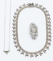 A small collection of costume jewellery to include a silver and sapphire set pendant and chain, a