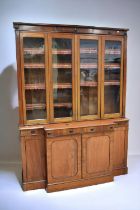 Large mahogany Victorian glazed bookcase cupboard with four opening glazed doors to reveal