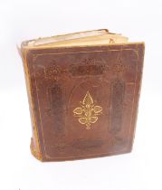 An Edwardian period leather-bound scrapbook, full of cuttings of various scenes - social, nature,