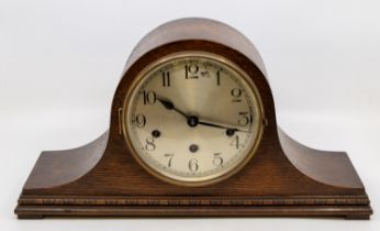 A 1930s oak Napoleon mantle 8 day mantle clock with Westminster chime.