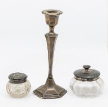 A George V single silver candlestick, hexagonal stepped base and stem, weighted, hallmarked Chester,